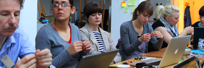 People at an electronics workshop